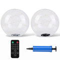 Two clear inflatable round balloons with warm white LED fairy lights inside, shown with a black remote control and a blue hand pump on a white background.