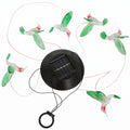 Solar-powered LED hummingbird string lights on a white background