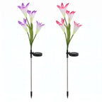 Zainzio 2-pack solar lily garden lights with pink and purple fabric petals and integrated solar panels on stakes