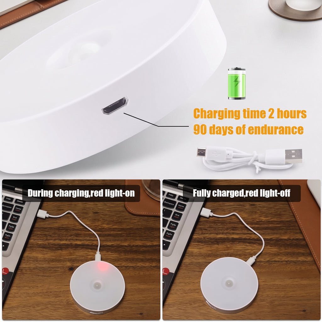 A white circular wireless charging pad shown in a close-up and in use on a wooden desk with a laptop. Text overlays state 'Charging time 2 hours 90 days of endurance' and show the charging light on during charging and off when fully charged.