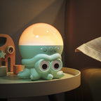 A cute octopus-shaped night light with a glowing warm dome on top, sitting on a round table in a cozy room setting.
