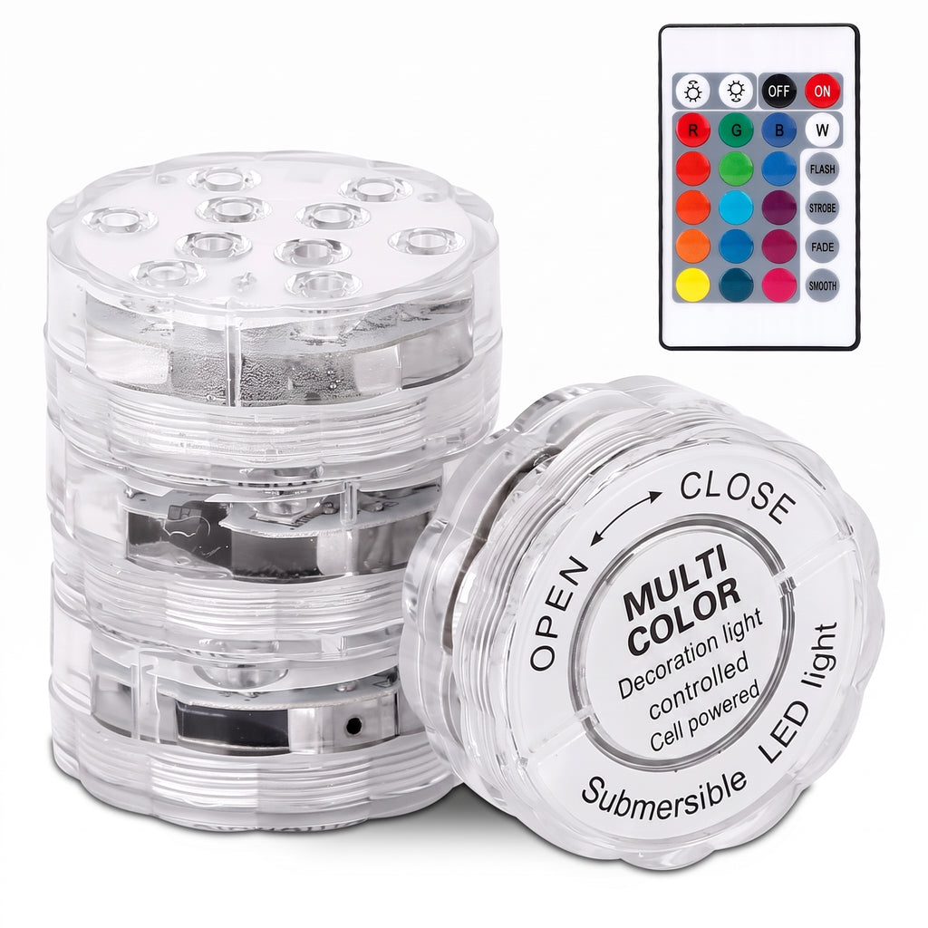 A stack of clear plastic underwater LED light cells with one open cell in front showing printed instructions, alongside a small remote control on a white background.