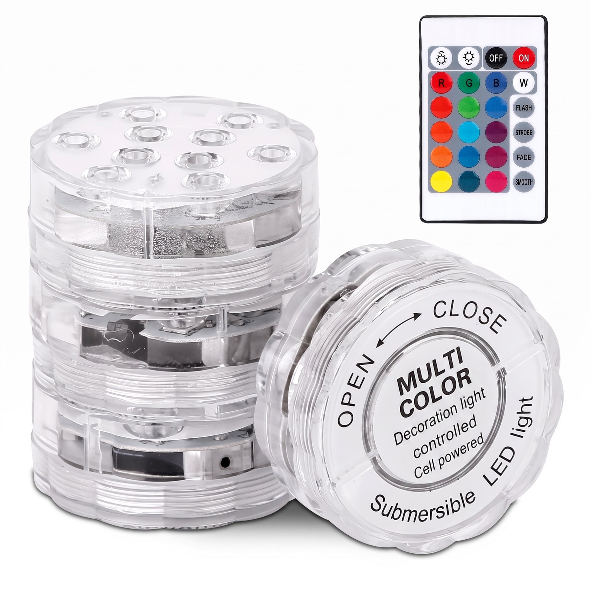 A stack of clear plastic underwater LED light cells with one open cell in front showing printed instructions, alongside a small remote control on a white background.